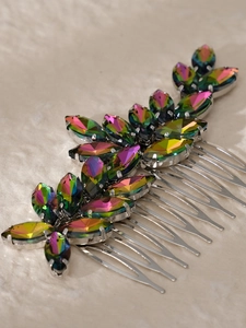 Macro detail of silver hair comb featuring iridescent marquise-cut rhinestones