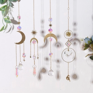 Detailed view of AB crystal suncatchers with moon and star metal patterns