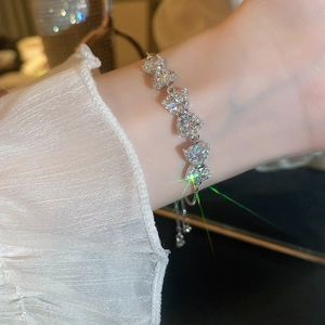 Elegant sparkling zircon bow bracelet in silver finish for women worn on the wrist