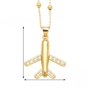 Macro detail of airplane pendant necklace with white crystals on beaded chain 45+5cm