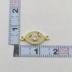 Detailed close-up of a 2cm gold Evil Eye charm connector with sparkling zircons