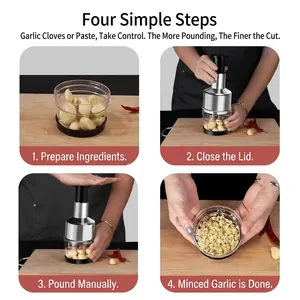 Manual stainless steel garlic press chopper with 4-step usage guide on a wooden board