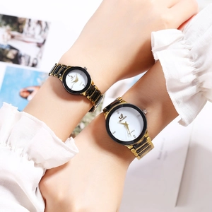 Elegant pair of ORLANDO quartz watches with gold and black steel bands for couples