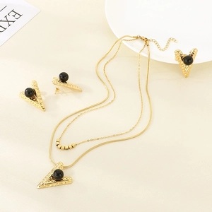 Golden V-shaped stainless steel jewelry set with hammered texture and black bead details