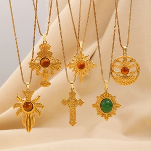 Vintage gold layered necklaces with tiger eye stones and sunburst cross pendants