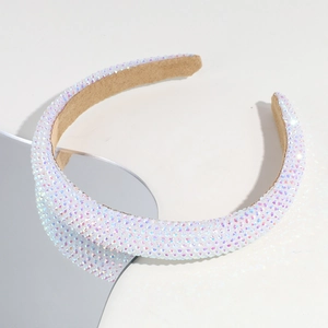 Close-up of sparkling colorful rhinestones on a wide baroque headband with soft inner lining
