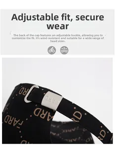 Detail of adjustable silver metal buckle and printed strap on a black baseball cap