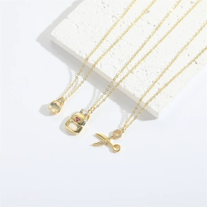 Retro gold scissors pendant necklace set with pink heart backpack and gem on white stone