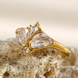 Macro view of 18K gold plated stainless steel ring with multi-cut butterfly zirconias