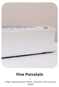 Macro shot of book-shaped ceramic vase featuring ribbed book-page texture and floral details