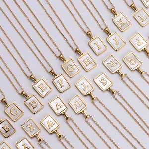 18k gold plated stainless steel initial necklace with white shell pendant collection