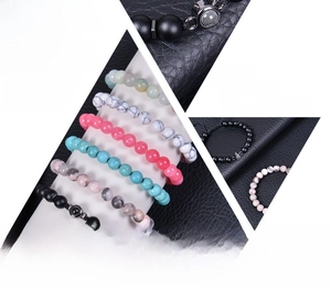 Macro view of multi-color natural gemstone beaded bracelets with projection stone details