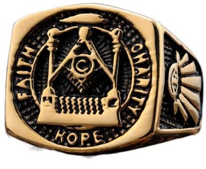 Macro shot of gold Masonic ring featuring Faith Hope Charity engravings and vintage relief