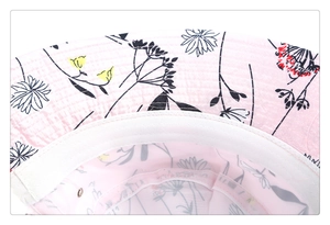 Close-up detail of the pink floral print and white inner lining of the bucket hat