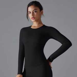 Close-up of black slim-fit yoga top featuring a classic round neck and ergonomic seams