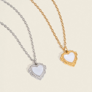French vintage heart shell necklace in gold and silver steel with relief texture