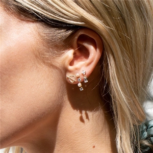Detail shot of S925 silver pearl drop earrings with sparkling heart and zircon studs