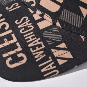 Detailed close-up of high-quality stitching and graffiti print on the baseball cap