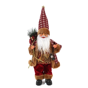 Standing Santa Claus doll in red plaid hat and brown robe holding gift bag and lantern