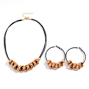 Modern layered necklace and hoop earrings set with gold rings and black cord