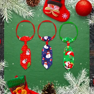 Flat lay of colorful Christmas pet neckties with snowman and Santa patterns for dogs