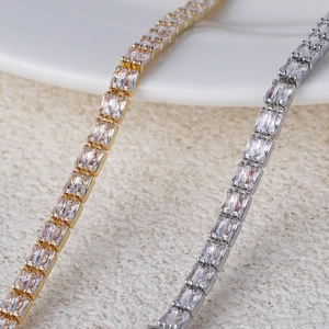Macro view of double-row rectangular zircon stones in gold and silver claw settings