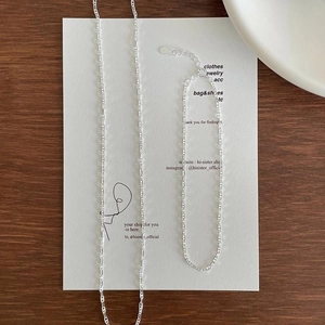 Macro detail of 925 sterling silver rectangular link chain with S925 stamp and lobster clasp