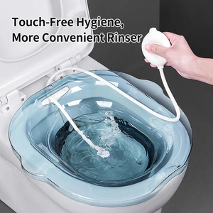 Transparent blue sitz bath basin for postpartum care with manual pump on toilet