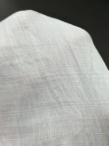 Detailed macro view of high-quality white cotton fabric texture with breathable weave