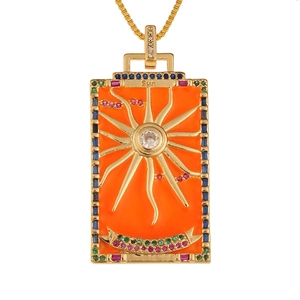 Detailed macro view of the Sun Tarot card pendant with colorful stones and enamel