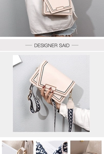 Macro detail of creamy white crossbody bag featuring stitching and wide patterned strap