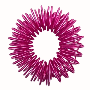 Detailed view of pink spiral metal sensory ring for finger massage and stress relief