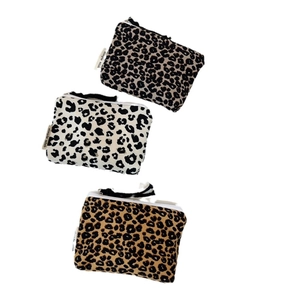 Three-piece leopard print canvas coin purses with zipper closures in assorted colors