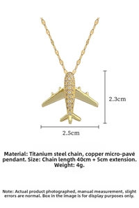 Detail of gold titanium steel airplane necklace showing size dimensions and weight