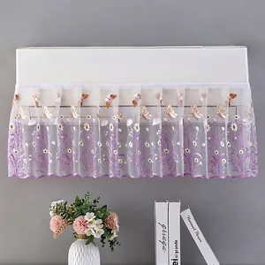 Detail of white lace air conditioner cover with purple daisy and butterfly embroidery