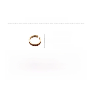 Macro shot of 14k gold-plated copper ring with embossed flower patterns and dimensions