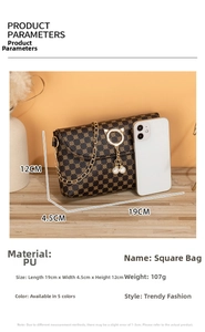 Detail view of mini PU leather crossbody bag with vintage print and pearl charm