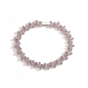Silver bracelet with butterfly links and pink crystals on white background