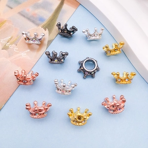 Detailed view of colorful rhinestone crown charms in four metallic finishes for DIY jewelry