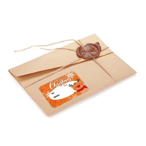 Christmas Kraft envelope with orange reindeer sticker and vintage wax seal decoration