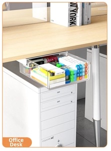 Macro view of transparent under-desk drawer storage box filled with office supplies