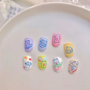 Macro view of 5D embossed nail art stickers with 3D cartoon bears and rainbow motifs