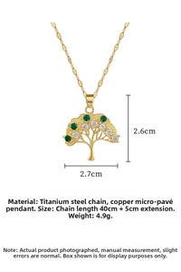 Macro shot of gold Tree of Life pendant with green and white zircons and titanium chain