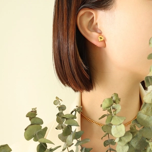 Unisex 18K gold plated titanium steel screw stud earrings worn with a flat chain necklace