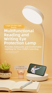 Macro detail of white LED desk lamp featuring flexible neck and integrated phone holder