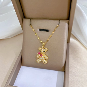 Exquisite gold-plated teddy bear necklace with sparkling zircons in a beige jewelry box