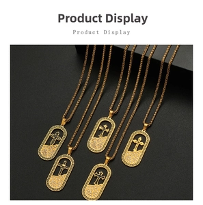 Detail of five 18K gold-plated cross necklaces with Greek key patterns and small diamonds