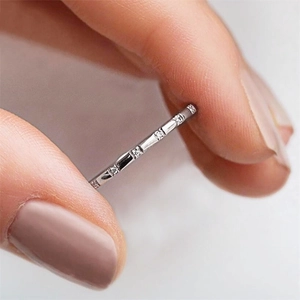 Delicate silver zircon eternity ring featuring a minimalist cross-stackable design for women