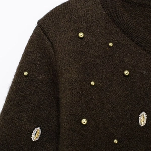 Dark brown knit cardigan with golden studs and amber rhinestone embellishments