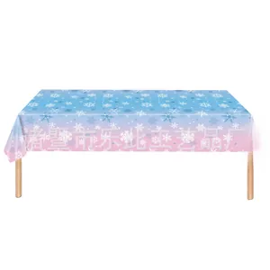Detail of disposable gradient snowflake tablecloth with festive pink and blue patterns